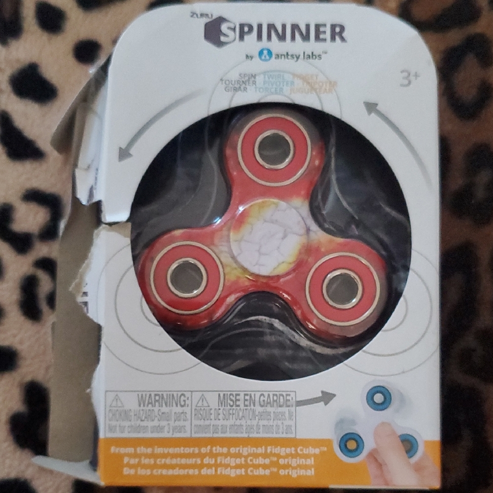 SOLD Red Spinner Toy